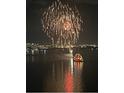 Fireworks at night over the water and a boat at 3301 Bayshore Blvd # 2401E, Tampa, FL 33629