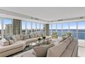 Open floor plan living room with expansive windows framing beautiful city and water views at 3301 Bayshore Blvd # 2401E, Tampa, FL 33629