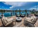 Inviting waterfront dock with comfortable seating, perfect for relaxing and enjoying the scenic views at 333 Island Way # 203, Clearwater Beach, FL 33767