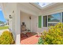 Charming front porch with a rocking chair and decorative tile flooring, offering a warm welcome at 3545 97Th N Ave # 4, Pinellas Park, FL 33782