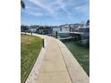 Waterfront condo docks and boat slips with multiple boats in the water at 400 64Th Ave # 202, St Pete Beach, FL 33706