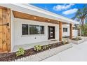 Charming front exterior featuring painted brick, wood accents and trim, and a modern door at 4500 22Nd N Ave, St Petersburg, FL 33713