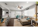 Bright living room with a comfortable sectional, ceiling fan, and a view of the entryway at 4519 S Grady Ave, Tampa, FL 33611