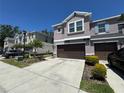 Charming two-story townhome with a two-car garage and well-maintained landscaping at 6617 Citrus Creek Ln, Tampa, FL 33625