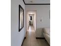 Hallway featuring tile floors and neutral paint at 7503 N Howard Ave, Tampa, FL 33604