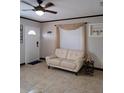 Inviting living room featuring tile floors and modern decor at 7503 N Howard Ave, Tampa, FL 33604