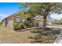 Charming single-story home with well-maintained lawn and a spacious two-car garage at 8704 Sandy Plains Dr, Riverview, FL 33578