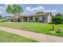 Well maintained lawn and landscaping add to the curb appeal of this charming one story home at 1104 Northridge Dr, Palm Harbor, FL 34683