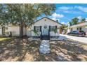Charming single-story home with lovely landscaping, a welcoming porch, and ample parking space at 1110 36Th N Ave, St Petersburg, FL 33704