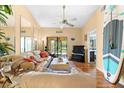 Comfortable living room with hardwood floors, a ceiling fan, and a sliding glass door at 11511 113Th St # 35E, Largo, FL 33778
