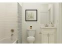 Clean bathroom featuring a tiled shower/tub combo, neutral decor, and a matching vanity with storage at 11829 Sparkling Topaz Cv, Parrish, FL 34219