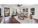 Bright living room featuring hardwood floors and ample natural light at 1207 E Giddens Ave, Tampa, FL 33603
