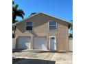 Detached two-car garage offering additional storage and parking space with a convenient side entrance at 13211 Park Blvd, Seminole, FL 33776