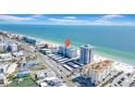 Aerial view of a condo building, highlighting its prime location near the beach and nearby amenities at 17400 Gulf Blvd # I4, North Redington Beach, FL 33708