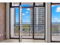Bright view of the harbor, tall buildings, and blue sky, from the outdoor balcony at 175 2Nd S St # 907, St Petersburg, FL 33701