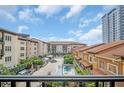 Beautiful courtyard view of a pool, lounge area, and manicured landscaping at 200 4Th S Ave # 303, St Petersburg, FL 33701
