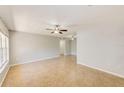 Bright and spacious living room with tile flooring, ceiling fans, and neutral paint at 2690 Coral Landings Blvd # 122, Palm Harbor, FL 34684