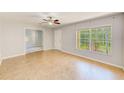 Living room featuring tile floors, natural light, a ceiling fan, and neutral paint at 2690 Coral Landings Blvd # 122, Palm Harbor, FL 34684