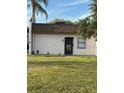 Charming single-story home featuring a well-maintained lawn and a welcoming front door at 2961 Flint N Dr, Clearwater, FL 33759