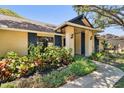 Charming front entrance with beautiful landscaping and elegant accents at 3041 Avalon Terrace Dr, Valrico, FL 33596