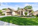 Charming single-story home with a well-manicured lawn and attractive landscaping at 3119 Bent Creek Dr, Valrico, FL 33596