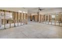 Renovated living space featuring an open concept, tile flooring, and ample natural light streaming through the windows at 401 Patica Ne Rd, St Petersburg, FL 33702