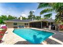 Beautiful pool area surrounded by lush landscaping, offering a private outdoor oasis at 500 Tallahassee Ne Dr, St Petersburg, FL 33702
