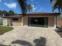 Spacious backyard with a brick patio, offering plenty of space for outdoor entertaining at 833 Lantana Ave, Clearwater Beach, FL 33767