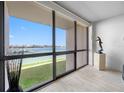 A spectacular water view is enjoyed through the large windows of this gorgeous condominium at 1 Key Capri # 211W, Treasure Island, FL 33706