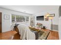 Bright living room with hardwood floors, a large window, and comfortable seating at 15034 Newport Rd, Clearwater, FL 33764