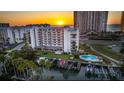 Gorgeous waterfront condo with boat dock, swimming pool, and nearby beach access at sunset at 1581 Gulf Blvd # 301N, Clearwater Beach, FL 33767