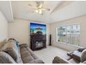 Cozy living room featuring a modern fireplace, neutral color scheme, and comfortable seating at 2050 28Th N Ave, St Petersburg, FL 33713