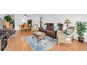 Open living room with wood floors, stylish furniture, and a cozy atmosphere for relaxation at 2469 Franciscan Dr # 19, Clearwater, FL 33763