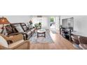 Inviting living room featuring comfortable seating, ample natural light, and stylish decor at 2469 Franciscan Dr # 19, Clearwater, FL 33763