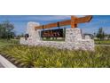 Beautiful stone sign and wood accents marking the entrance to the Childers community at 34780 Rainville Loop, Zephyrhills, FL 33541