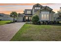 Charming two-story house with well-maintained lawn and welcoming curb appeal at 3952 Bonfire Dr, Odessa, FL 33556