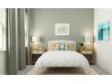 Cozy bedroom with calm colors, a bed between two side tables and a framed art piece above the bed at 4470 Southern Valley Loop, Brooksville, FL 34601