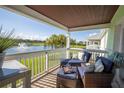 Relaxing balcony with comfortable seating and a stunning lake view at 4816 Snook Se Dr # F, St Petersburg, FL 33705