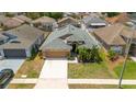 Charming single-Gathering home with a well-kept lawn and a two-car garage in a quiet residential neighborhood at 518 Greg St, Valrico, FL 33594