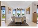 Elegant dining room with large windows offering great views, a marble table, and stylish seating at 555 5Th Ne Ave # 424, St Petersburg, FL 33701