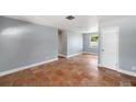 Bright, airy living room with terracotta floors, freshly painted walls and ample natural light at 5660 Hobson Ne St, St Petersburg, FL 33703