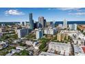 Beautiful cityscape view with stunning skyscrapers, lush trees, and sparkling ocean in the background on a clear sunny day at 600 3Rd S Ave # 201, St Petersburg, FL 33701
