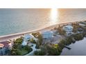 Sprawling beach homes are surrounded by lush landscaping and the tranquil ocean at 770 N Manasota Key Rd, Englewood, FL 34223