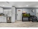 Bright kitchen features white cabinets, stainless steel appliances, and modern countertops, offering a clean and stylish cooking space at 10562 Lake Dr, Seminole, FL 33772