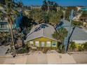 Cozy cottage-style home surrounded by lush landscaping providing a secluded and peaceful setting at 12409 Gulf Blvd, Treasure Island, FL 33706