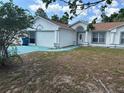 Charming single-story home with a well-maintained front yard and beautiful blue accents at 12447 Drysdale St, Spring Hill, FL 34609