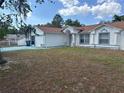 Inviting single-story home with a tidy front yard and a charming exterior facade at 12447 Drysdale St, Spring Hill, FL 34609