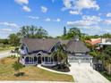 Beautiful Victorian home with a large lot, well-manicured lawn and two-car garage at 1500 Elmwood St, Clearwater, FL 33755