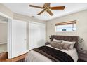 Cozy bedroom with hardwood floors, a comfortable queen-size bed, and a double door closet at 250 W Canal Dr, Palm Harbor, FL 34684