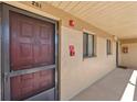 Inviting condo entrance highlighting unit 201, a secure screen door, and a convenient walkway at 2693 Sabal Springs Cir # 201, Clearwater, FL 33761